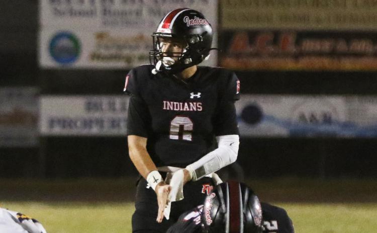 Fort White quarterback Matthew Pitts lines up for a snap during Friday’s win over Union County. (MORGAN MCMULLEN/Lake City Reporter)