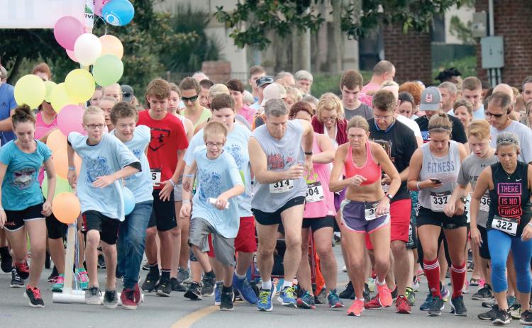 Participants sprint off the starting line at a previous year’s Pregnancy Care Center 5K Walk/Run 4 Life event in Lake City. (FILE)