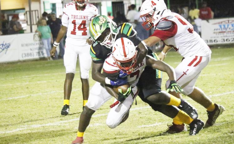 Suwannee defensive lineman Kamari Thompson tackles Hamilton County running back Matthew Berry on Friday. (JAMIE WACHTER/Lake City Reporter)