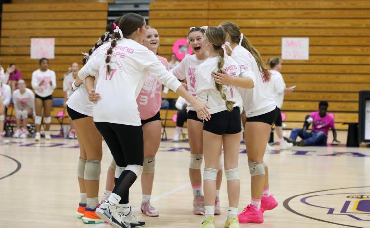 Columbia's volleyball team celebrates after a point during Tuesday's win over Lowndes. (BRENT KUYKENDALL/Lake City Reporter)