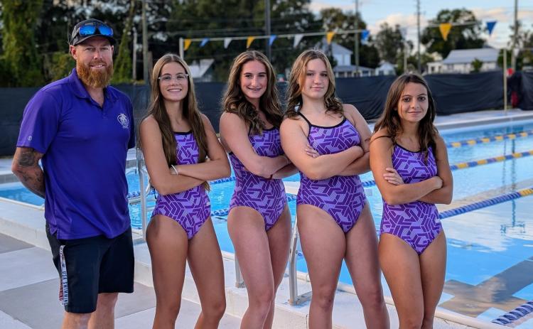 Columbia had four swimmers qualify for the Region 1-3A meet this week. Pictured are Columbia coach Ryan Shoemaker (left) and all four qualifiers: Brie Fair (from left), Alli Jenkins, Emma Fielding and Gabby Tonetti. (COURTESY)