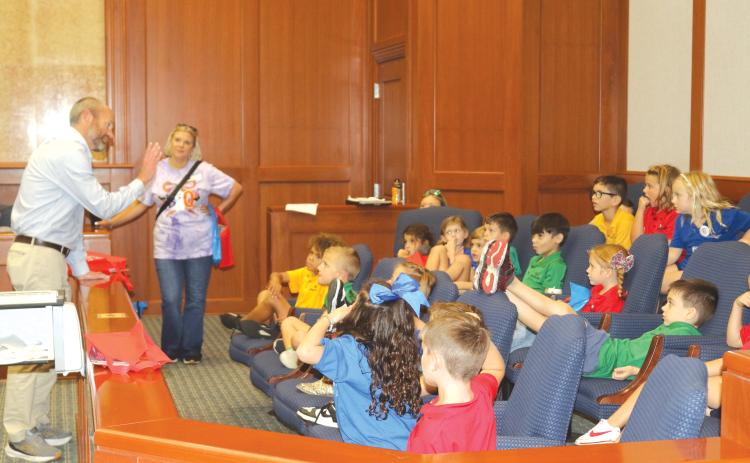 State Attorney for the Third Judicial Circuit John Durrett (left) walks Belmont Academy students through the legal process during a field trip on Thursday. (TONY BRITT/Lake City Reporter)