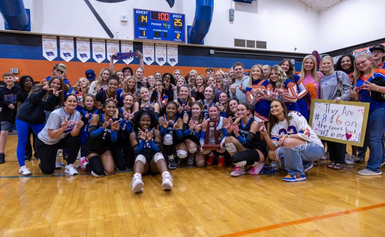 Branford's volleyball team celebrates with fans after defeating Union County to win a third straight Region 3-R title on Tuesday. (JACK HOWDESHELL/Lake City Reporter)