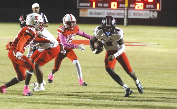 Fort White quarterback Jayden Jackson runs through the middle of Hamilton County’s defense on Friday. (MORGAN MCMULLEN/Lake City Reporter)