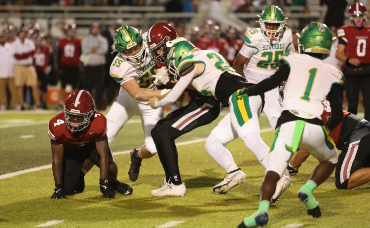 Suwannee defensive ends Reese Bronson (55) and Kyler Watson (24) tackle Chiles receiver Cade Frier on Thursday. (PAUL BUCHANAN/Lake City Reporter)