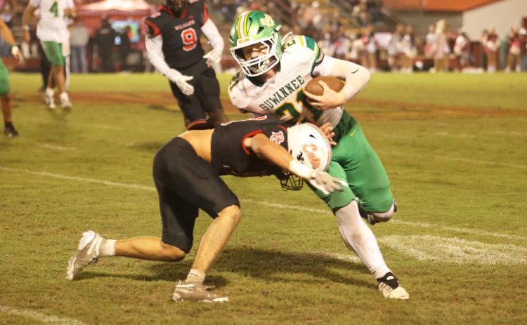 Suwannee tight end Hunter Watson is tackled after a catch against Baker County on Friday. (PAUL BUCHANAN/Lake City Reporter)