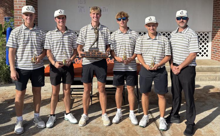 The Suwannee boys golf team shows off its trophy after winning the Ann and John Ives Invitational on Thursday. (COURTESY)
