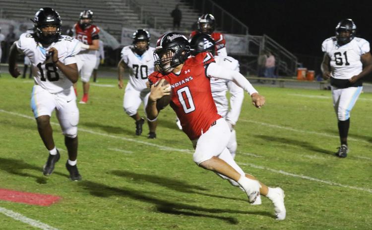 Fort White running back Ezekiel Powell sprints around the Zarephath Academy defense during last Friday’s 49-6 win. (MORGAN MCMULLEN/Lake City Reporter)