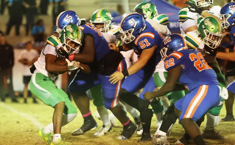 Suwannee running back Lou Jack Smith is corralled by Taylor County defenders on Oct. 17. (PAUL BUCHANAN/Lake City Reporter)
