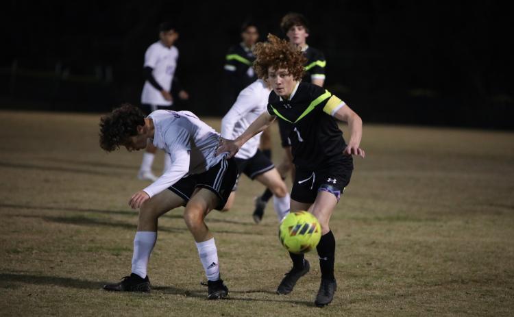 Columbia's Brendan Schwartz chases after possession of the ball during a match against Gainesville last season. (BRENT KUYKENDALL/Lake City Reporter)