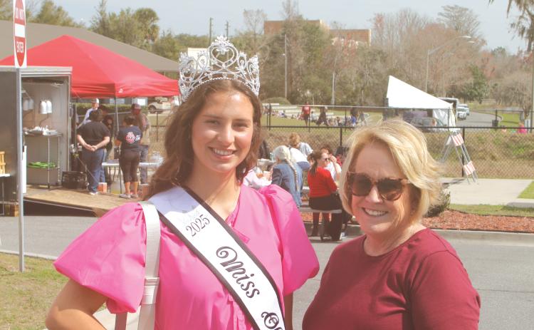 Miss Olustee Layla Merola smiles with Patti Aldous of the Miss Olustee pageant during the opening of this year’s Olustee Festival. (FILE)