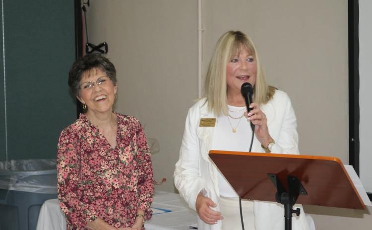 Sara Singleton (left) stands with Sharon Souder, Pregnancy Care Center executive director, after being named the Ministry of the Year award recipient Tuesday night at the organization’s annual volunteer banquet. (TONY BRITT/Lake City Reporter)
