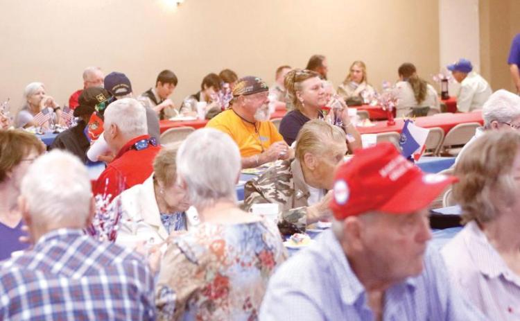 Veterans dine during a prior Veterans Dinner at the Florida Gateway Fairgrounds. (FILE)