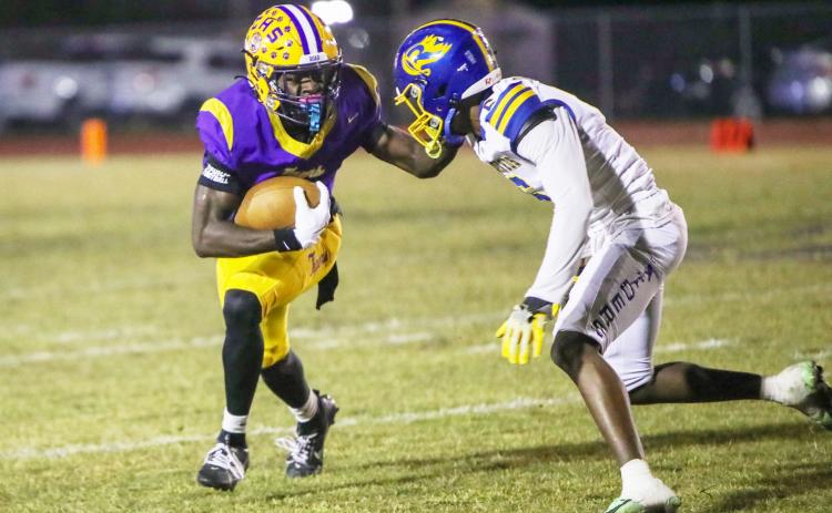 Columbia receiver Kyren Caldwell fights off a Rickards defender during last Friday’s Region 1-4A quarterfinal. (BRENT KUYKENDALL/Lake City Reporter)
