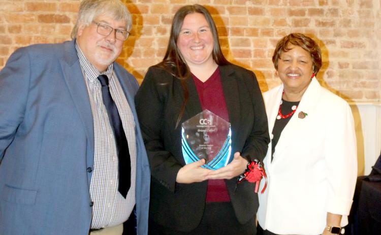 Briana Collier, a Lake City Middle School math teacher, was named the Columbia County School District’s Teacher of the Year on Thursday. She received her award from Superintendent Keith Couey and School Board Chair Narrie Smith. (TONY BRITT/Lake City Reporter)
