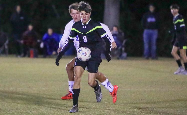 Columbia's Braxton Dicks chases down possession of the ball against Keystone Heights on Nov. 10. (BRENT KUYKENDALL/Lake City Reporter)