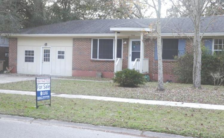 A ‘For Sale’ sign sits in a Lake City house’s front yard previously. Lake City recently saw a 21.4% reduction in close sales on single-family homes for the third quarter of 2025 from the 2024 mark. (FILE)