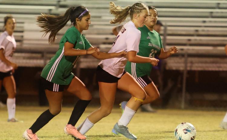 Columbia's Leah Shields dribbles in to score a goal against Suwannee on Thursday. (PAUL BUCHANAN/Lake City Reporter)