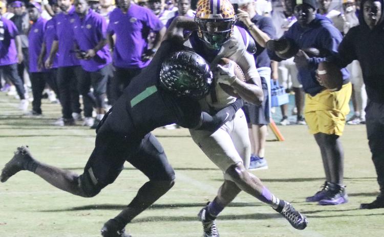 Columbia running back Kameron Mills is stopped by Choctaw safety Alante Reese two yards short of the first down on 4th-and-4 in the final minute of Friday's Region 1-4A semifinal. (JORDAN KROEGER/Lake City Reporter)