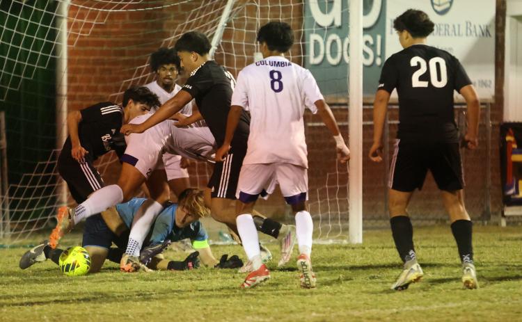 Columbia's defense corrals the ball to clear it away after goalkeeper Logan Wheeldon made a save during Wednesday's win over Suwannee. (PAUL BUCHANAN/Lake City Reporter)