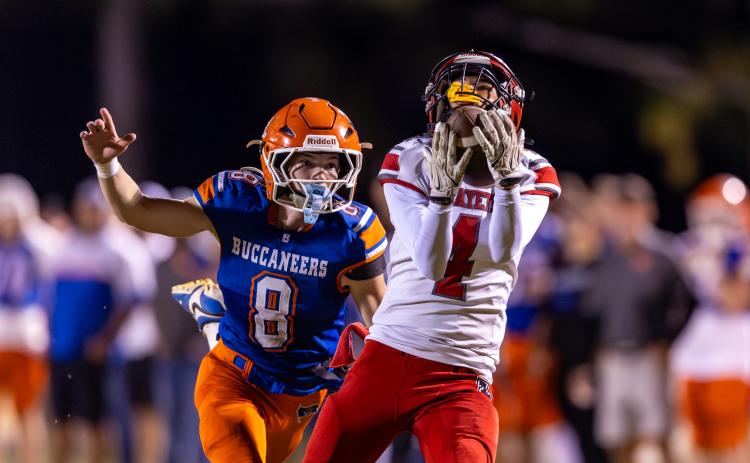 Lafayette receiver Kaeden Woods catches a pass in front of Branford defensive back Tripp Schultz on Oct. 24. (JACK HOWDESHELL/Lake City Reporter)