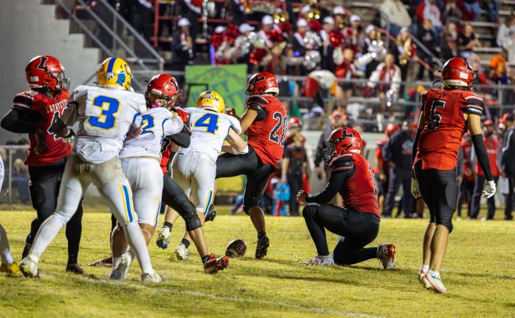 Chipley linebacker Tucker Locke blocks Lafayette kicker Alex Townsend’s extra point attempt that ended up being the difference in the game Friday. (JACK HOWDESHELL/Lake City Reporter)