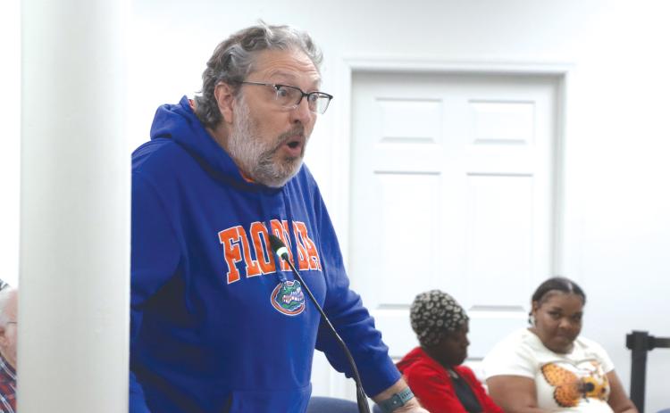 Former Lake City Councilman Todd Sampson (left) addresses the council regarding its housing plan during Monday’s workshop. (MORGAN MCMULLEN/Lake City Reporter)