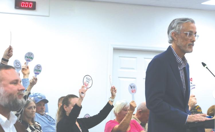 Price Creek LLC attorney Patrick Krechowski (right) addresses the Lake City Council in front of protesting Price Creek residents during Monday’s meeting. (MORGAN MCMULLEN/Lake City Reporter)