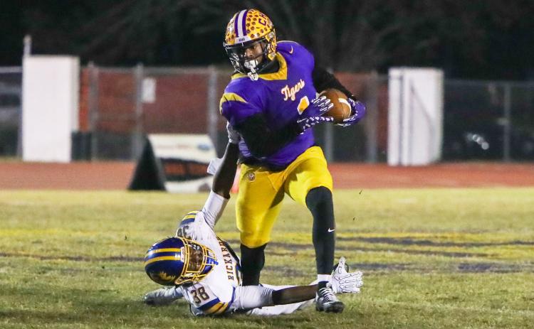 Columbia running back Kameron shakes off Rickards linebacker Marlon Wilson after stiff-arming him on his way to a 41-yard touchdown run during Friday’s Region 1-4A quarterfinal. (BRENT KUYKENDALL/Lake City Reporter)