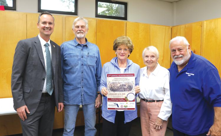 Blue-Grey Army officials unveiled the 2026 Olustee Festival Poster at their meeting Tuesday with Columbia County Clerk of Court Jay Swisher (from left), Past Commanding General General Tom Coleman, Mantha Young of Mac Media, Blue-Grey Army Executive Director Faye Warren and Commanding General Tony Buzzella. (TONY BRITT/Lake City Reporter)