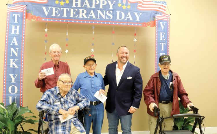 The oldest veterans to attend the annual veterans barbecue luncheon posed for a picture with State Rep. Danny Alvarez during the event. Pictured from left are: Leonard Kenneth Keen, 94, Army veteran; Donald Christensen, 95, Air Force veteran; Ray DeCant, 100, World War II veteran, State Rep. Danny Alvarez and Walt Lhamon, 93, Air Force veteran. (TONY BRITT/Lake City Reporter)