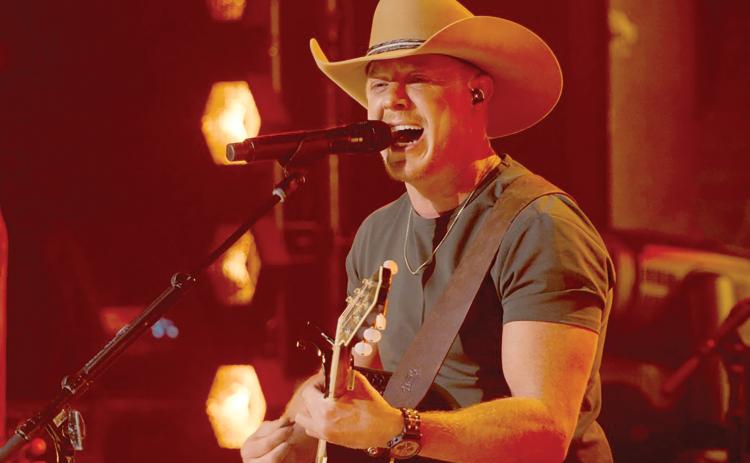 Lake City’s Adam Sanders performs during last week’s airing of ‘The Road’ on CBS. Sanders is one of three finalists in the reality series that concludes Sunday. (COURTESY)