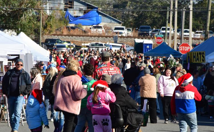 Tens of thousands of people flock annually to downtown Live Oak for Christmas on the Square. (FILE)