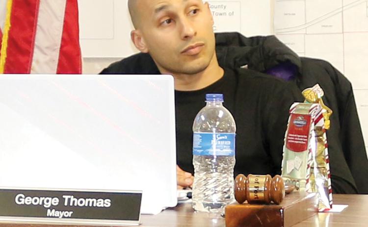 Fort White Mayor George Thomas listens as Town Attorney Rhett Bullard speaks during Monday night’s meeting. Thomas later abruptly stormed out of the meeting during a heated debate about meeting decorum. (TONY BRITT/Lake City Reporter)