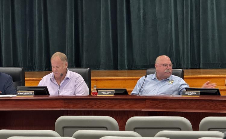 Commissioner Rocky Ford (right) said Thursday’s meeting was a ‘choreographed hit job’ on him by Commissioner Robby Hollingsworth (left) and Assistant County Manager Kevin Kirby. (JAMIE WACHTER/Lake City Reporter)