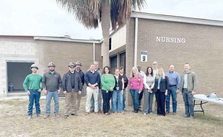 Suwannee County School District officials and representatives from Scorpio held a topping out ceremony Monday on the new nursing building addition at RIVEROAK Technical College. (COURTESY TJ VICKERS/Suwannee County School District)