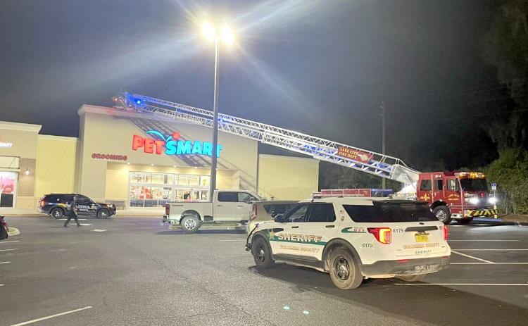 A special needs child was rescued from the roof of PetSmart on Wednesday night by Lake City police officers and Lake City firefighters. (COURTESY LAKE CITY FIRE DEPARTMENT)