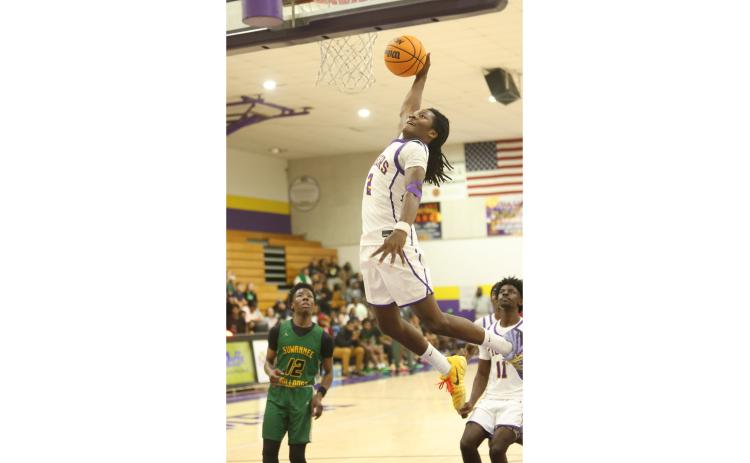 Columbia guard Kadrian Wilson flies through the lane for a dunk against Suwannee on Friday. (PAUL BUCHANAN/Lake City Reporter)