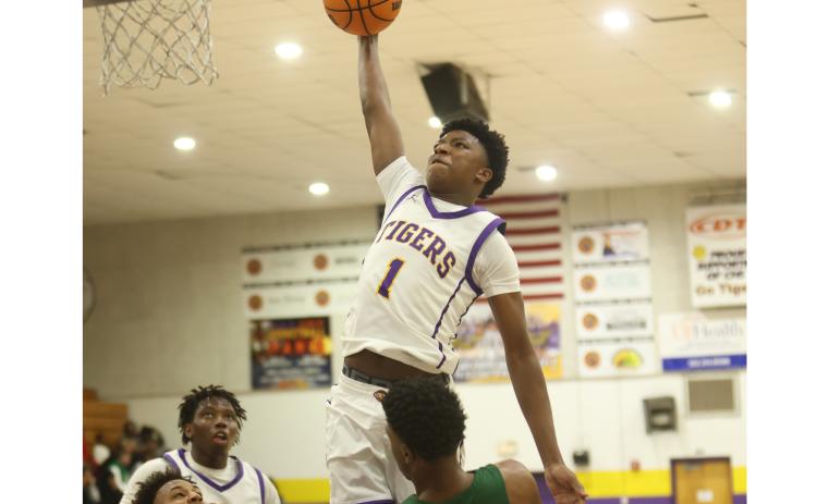 Columbia guard Shaheed White, soaring in for a bucket against Suwannee on Dec. 12, leads the Tigers offensively heading into this weekend’s Holiday Hoopfest in Fort Myers. (PAUL BUCHANAN/Lake City Reporter)