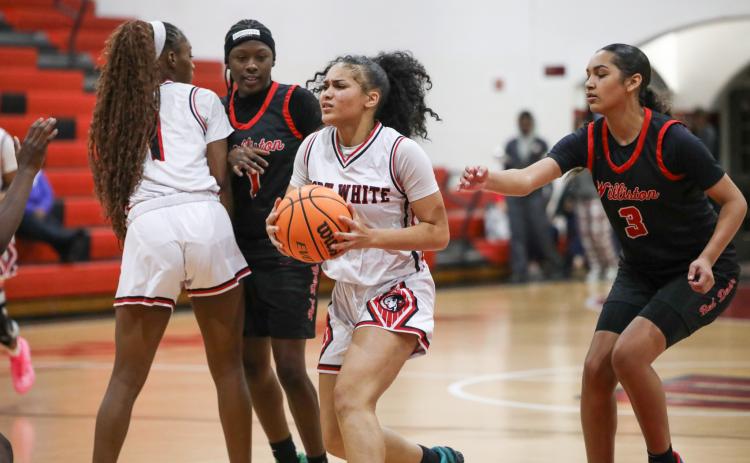 Fort White guard Mariah Cox tries to find a driving lane against Williston on Tuesday. (BRENT KUYKENDALL/Lake City Reporter)