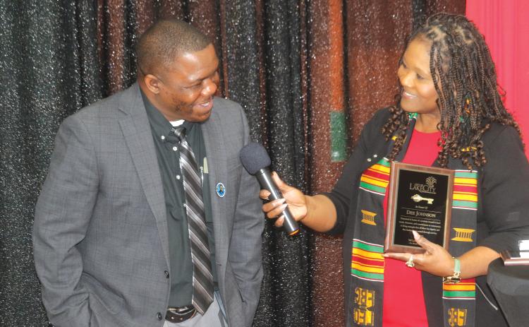 Assistant City Manager Dee Johnson (left) accepts a plaque from Councilwoman Chevella Young during the inaugural MLK Celebration Brunch on Sunday at the Richardson Community Center. (TONY BRITT/Lake City Reporter)