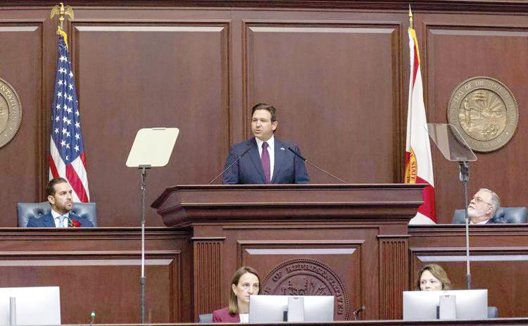 Florida Governor Ron DeSantis delivers his State of the State address as Florida House Speaker Daniel Perez (left) and Florida Senate President Ben Albritton (right) listen Tuesday. (MATIAS J. OCNER/Miami Herald/TNS)