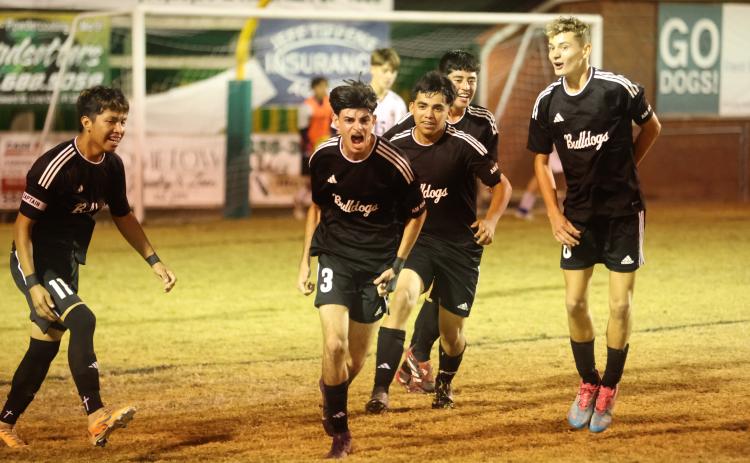 Suwannee's Rember Alonso (3) celebrates with teammates after scoring a goal against Williston on Nov. 21, 2025. (PAUL BUCHANAN/Lake City Reporter)