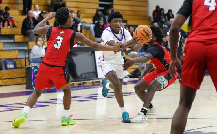 Columbia guard Shaheed White is fouled by Leon guard Elijah Knight while driving to the basket during Thursday's District 2-5A semifinal. (BRENT KUYKENDALL/Lake City Reporter)