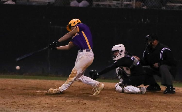 Columbia second baseman Goose Lord swings and misses at a pitch against Providence in the sixth inning Tuesday night. He struck out with the bases loaded. (BRENT KUYKENDALL/Lake City Reporter)