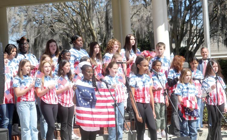 Richardson Sixth Grade Academy students from the school’s chorus and theatre program sing a song during a skit at the local 250th Birthday Party for America kickoff celebration on Tuesday morning. The event was attended by more than 200 people. (TONY BRITT/Lake City Reporter)