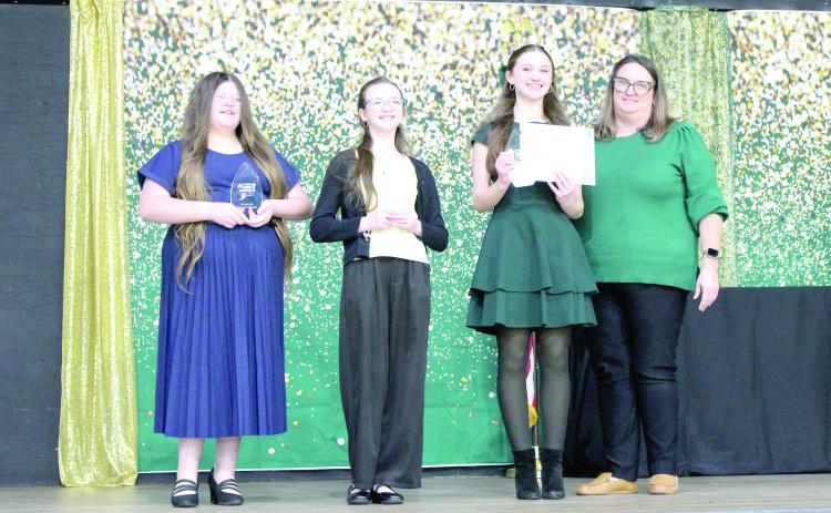 Sixth grade winners in the Suwannee County 4-H Public Speaking Contest were Kendell Wynn, third place (from left); Mikayla Richardson, second place; Kellyn Crocker, first place; and Katie Jones, 4-H Extension Agent. (COURTESY)