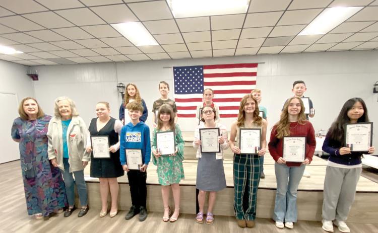 American Legion Auxiliary Unit 57 American Essay Contest winners included, in front, Irma Wehrli (from left), Judy Ripple, Kynlee Bogie, Timothy Steele, Kazzeley Vernon, Darien Cooper, Daelyn Cooper, Witness Hatch, Katheryn Coleman; back row, Olivia Medeiros, William Matheney, Madison Cruess, Kaiden Berg and Mason Garling. (COURTESY)