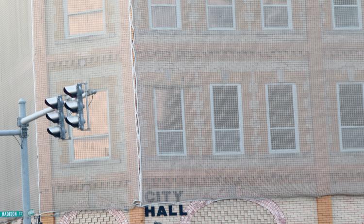 The net that has been wrapped around Lake City Hall since 2018 as a safety precaution to prevent bricks from falling on pedestrians has reached the ‘end of its life.’ The Lake City Council is considering awarding a bid to have the mortar of the bricks and window lintels repaired. (FILE)