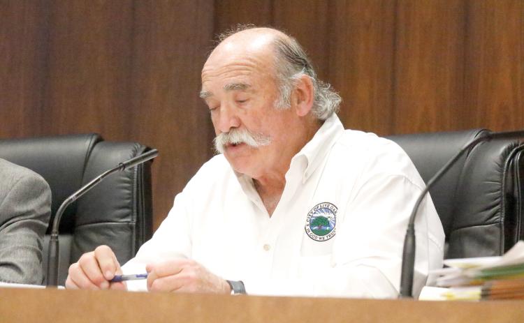 Live Oak City Manager Larry Sessions addresses the council on Tuesday night. The council has not fully completed its annual performance review of Sessions. (JAMIE WACHTER/Lake City Reporter)
